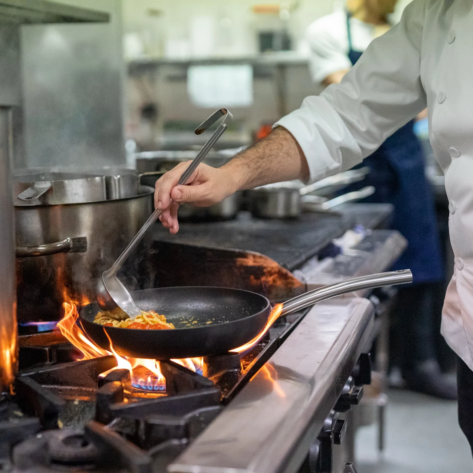 Flame cooking in kitchen